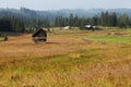 Morning misty landscape over hay stall Royalty Free Stock Photo