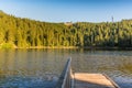 Morning mood at Mummelsee Lake in the Black Forest, view to the Hornisgrinde