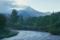 Morning on a mountain river, forested shores, light fog. Travel and vacation