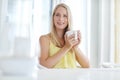 Morning musings. an attractive young woman drinking a coffee at home. Royalty Free Stock Photo