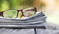 Morning news concept - newspaper and eyeglasses Royalty Free Stock Photo