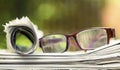 Daily news, reading concept, newspaper with with eyeglasses Royalty Free Stock Photo