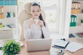 Morning in the office. Young pretty business lady economist is e Royalty Free Stock Photo