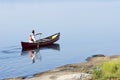 Morning Paddle in a Red Canoe