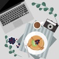 Morning pancake with berries and syrup and coffee serve on table