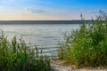 Morning panorama view over river from fishing place to opposite bank, reflection of sky in the water level Royalty Free Stock Photo