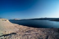 Morning panoramic view on sea bay surrounded by arid soil of Pag island on Dalmatian coast in Croatia. Clear blue sky
