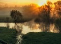 Morning. a picturesque foggy dawn by the river. Sun rays Royalty Free Stock Photo