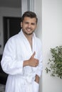 Morning portrait of handsome young man in bathrobe Royalty Free Stock Photo