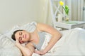 Morning portrait of sleeping young beautiful woman lying at home in bedroom on bed Royalty Free Stock Photo