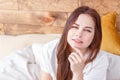 Morning portrait of young pensive pretty woman relaxing alone on bed