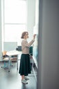 Beautiful teacher preparing for her first lesson.