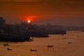 The morning of the red sunrise over the noise-free Buriganga river at Sadarghat, Dhaka