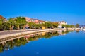 Morning reflections of Bibinje village on calm sea Royalty Free Stock Photo