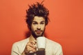 Morning refreshment of surprised man with cup of tea, coffee Royalty Free Stock Photo