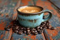 Morning ritual: a cup of coffee and coffee beans on an old table