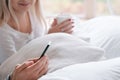 Morning ritual young couple bed drink smartphone Royalty Free Stock Photo
