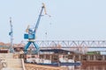 Morning on the river berth of the shipyard. Fog over the water. New boats near the slip. Coal warehouse. Old automobile Royalty Free Stock Photo