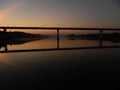 Morning at the river and bridge reflections in the water landscape Royalty Free Stock Photo