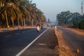 Morning Road Amidst Trees with motorcyclists