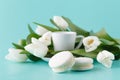 Morning romantic gift with white tulips and coffee cup