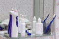 Daily morning routine set up in the bathroom: eye lens equipment, container, eye drops, lenses, tooth brush, paste. Royalty Free Stock Photo