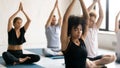African trainer and group of people meditating during yoga class Royalty Free Stock Photo