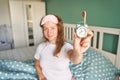 Morning routine. Young pretty woman wake up at home. Bed time. Snooze alarm Royalty Free Stock Photo