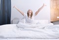 Woman stretching in bed after wake up Royalty Free Stock Photo