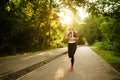 Morning run, woman on training in summer park Royalty Free Stock Photo