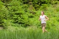 Morning run: Young man jogging in nature Royalty Free Stock Photo