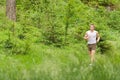 Morning run: Young man jogging in nature Royalty Free Stock Photo