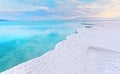 Morning scenery - white salt crystals beach, clear water near, typical landscape at Dead Sea shore, Israel