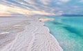 Morning scenery - white salt crystals beach, clear water near, typical landscape at Dead Sea shore, Israel Royalty Free Stock Photo