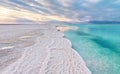 Morning scenery - white salt crystals beach, clear water near, typical landscape at Dead Sea shore, Israel