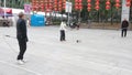 Shenzhen, China: elderly people play top as a fitness exercise in the morning sports square