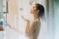 Morning shower.Taking rejuvenating cold shower.Self care moment.Everyday personal hygiene.Unfocused woman showering in glass Royalty Free Stock Photo