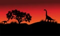 At morning silhouette eoraptor and brachiosaurus Royalty Free Stock Photo