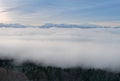 Morning sky and cloud over the snow capped alps mountain range. Royalty Free Stock Photo