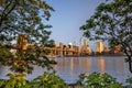 Morning skyline of New York City with Brooklyn Bridge and trees Royalty Free Stock Photo