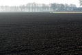 Morning spring landscape with newly plowed field, farmland in Netherlands, Europe