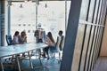 The morning staff meeting. Full length shot of a group of businesspeople meeting in the boardroom. Royalty Free Stock Photo