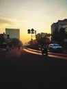 morning street in Jakarta southeast asia. road view. motorcycles. sillhouete