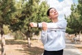 Morning stretches. cheerful young woman stretching in park before a run. healthy lifestyle and wellbeing Royalty Free Stock Photo