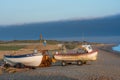 Morning Sun on Fishing Boats on a Shingle Beach