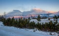 The morning sun illuminates the snowy peaks of the peaks in the foothills of the High Tatras Royalty Free Stock Photo