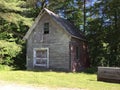 Waitsfield Vermont old barn in woods. Royalty Free Stock Photo