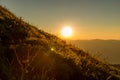 The morning sun and the orange sky above the mountains. Twilight sky background. Colorful Sunset sky and cloud. vivid sky in twili Royalty Free Stock Photo