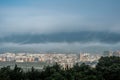 In the morning, the sun shines on the town under the advection fog Royalty Free Stock Photo