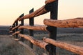 Morning sun shining on a ranch fence in Wyoming.